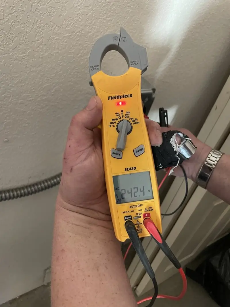 Voltage testing with clamp meter during Aluminum Wiring Replacement in Jennings